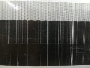 Photo depicting test print from a damaged head   